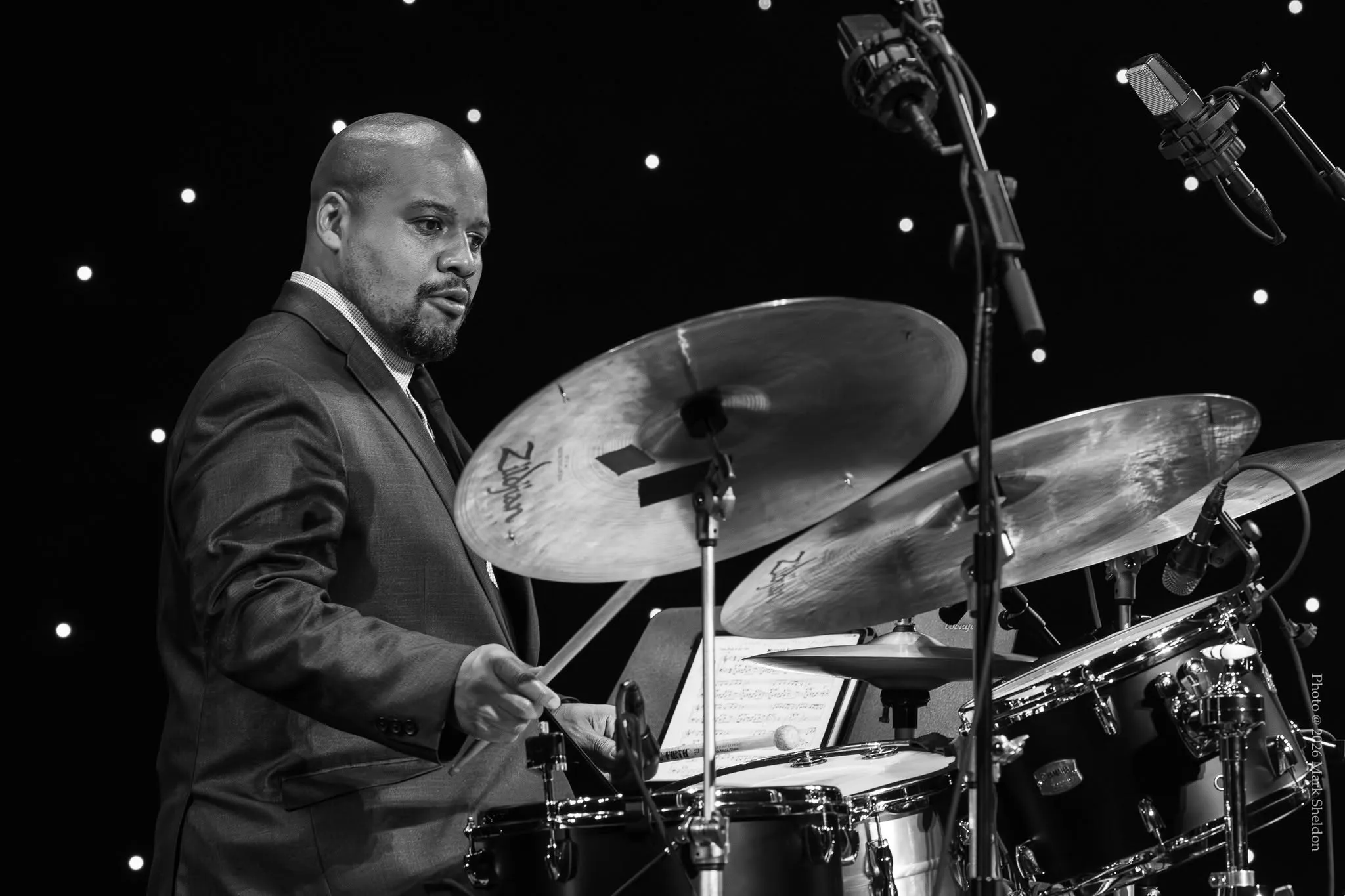 Sean Dobbins at the drums, black and white. Photo: Mark Sheldon.