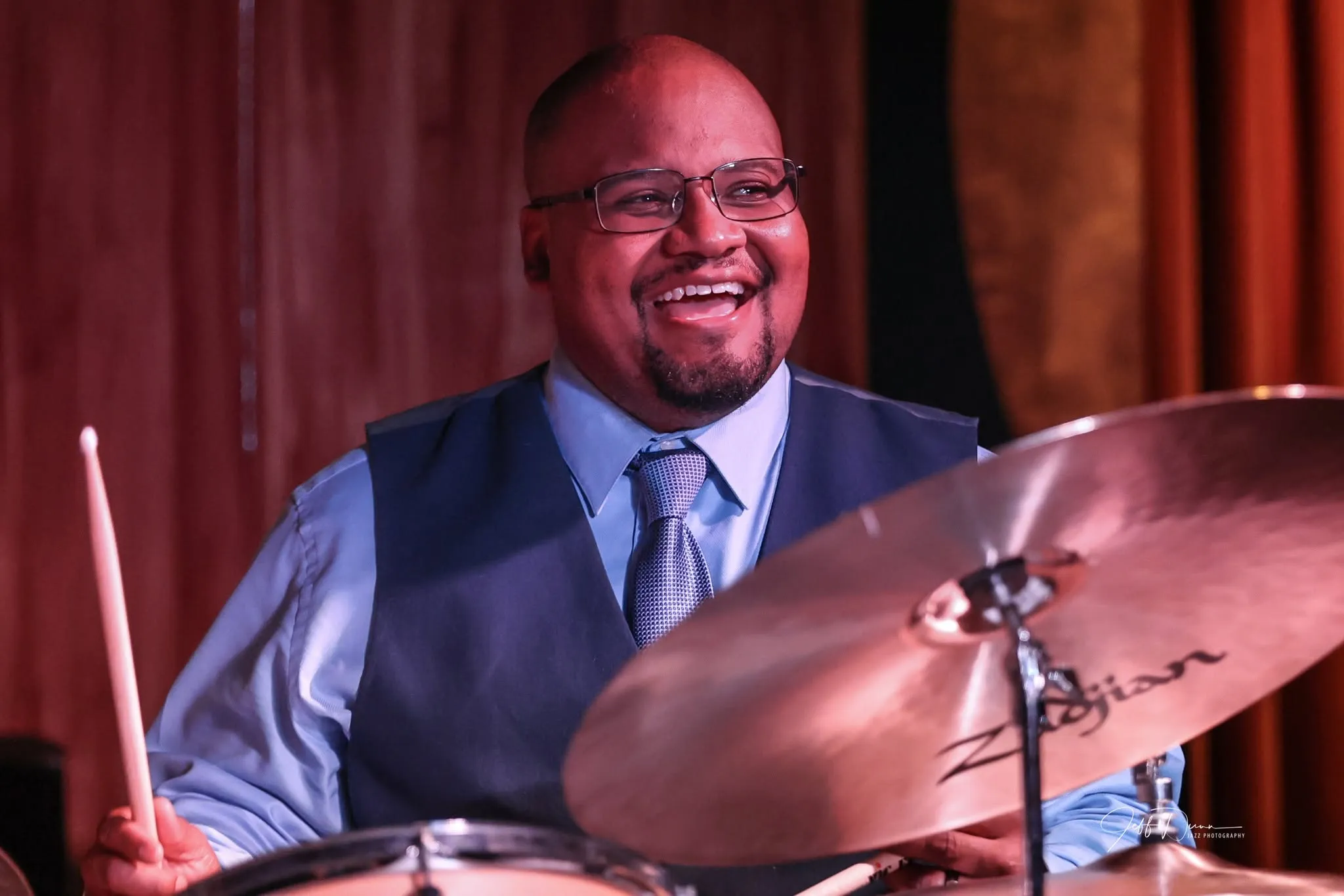 Sean laughing behind the cymbals. Photo: Jeff Dunn Jazz Photography.