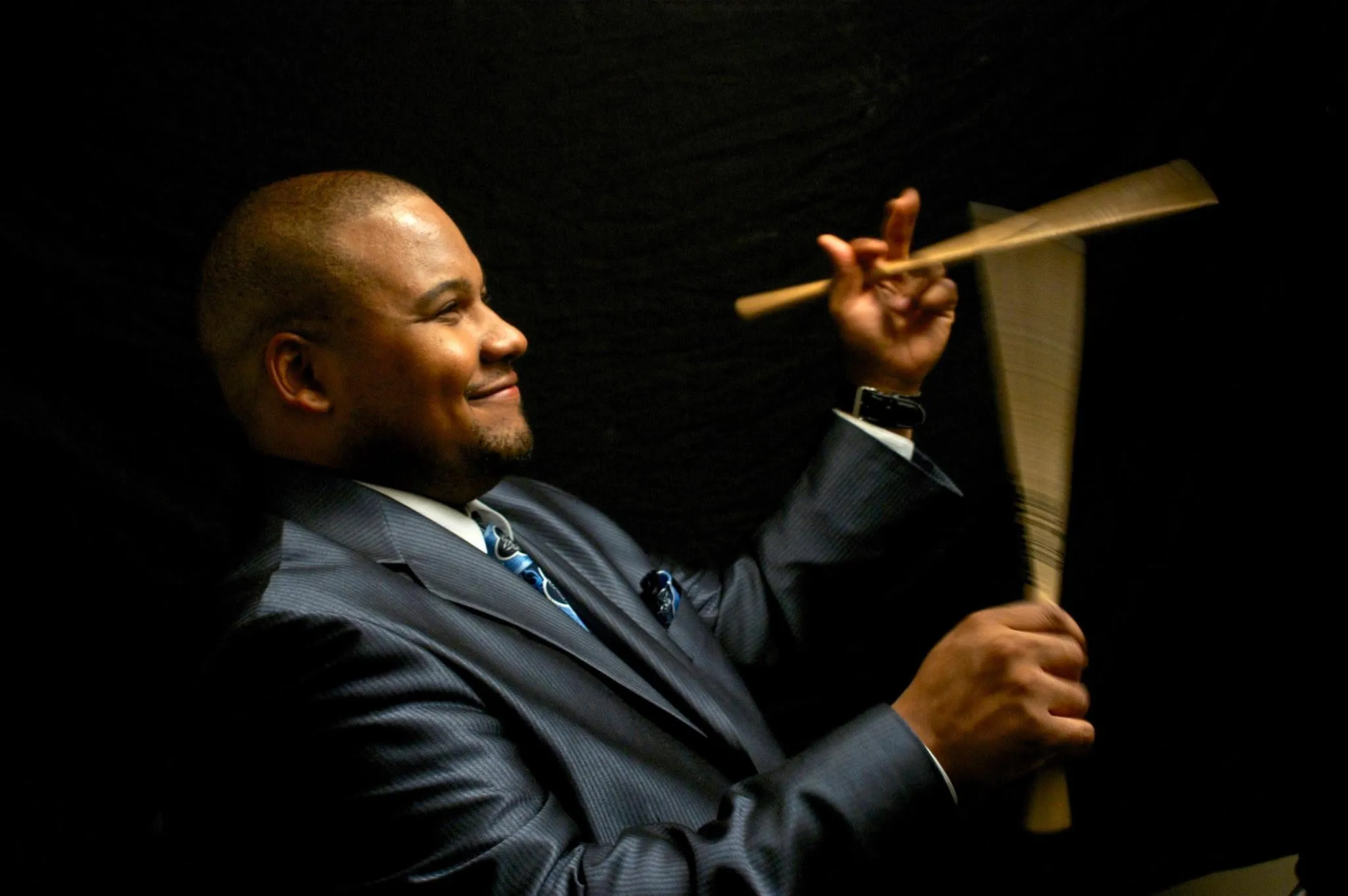 Sean Dobbins with brushes, in profile.